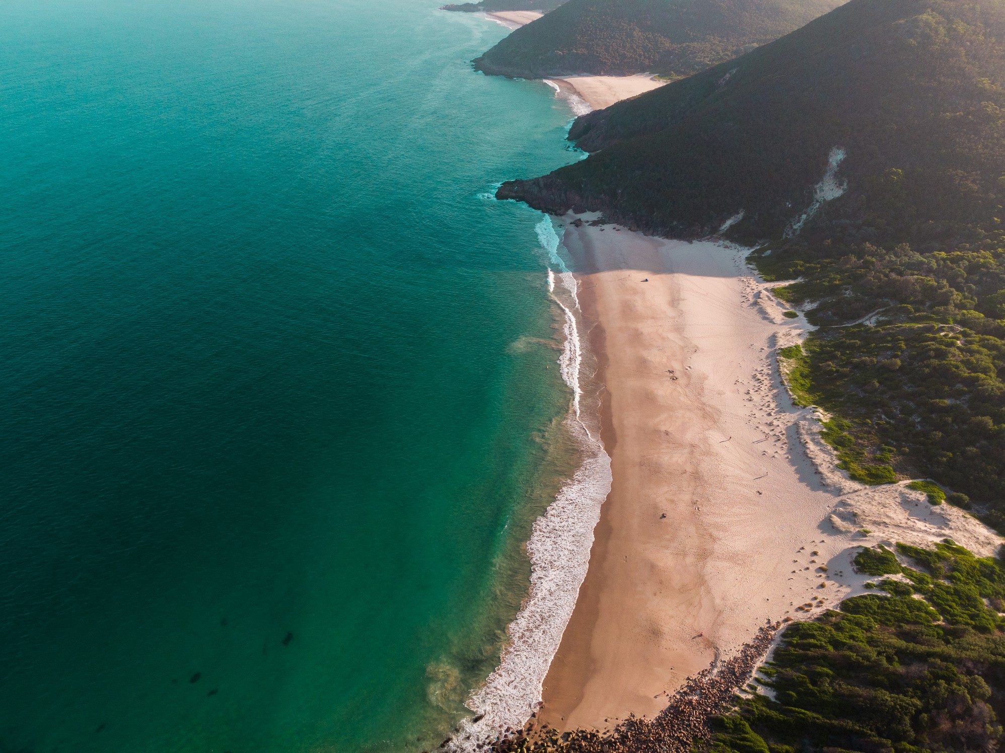 Aerial drone photo of a beach and headland